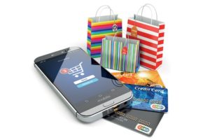 colorful shopping bags, a phone indicating a shopping cart and three credit cards to help you shop online
